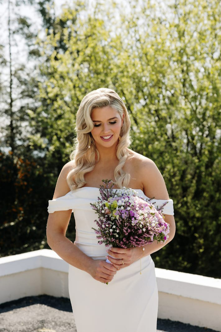 Olivias Flowers bride holding bouquet